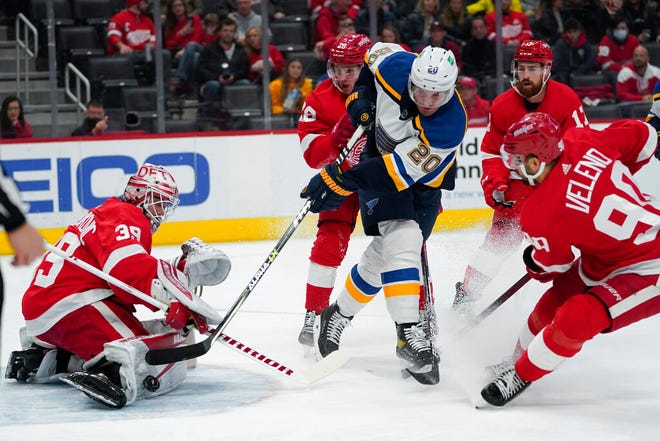 Detroit Red Wings goaltender Alex Nedeljkovic (39) stops a shot by St. Louis Blues left wing Brandon Saad in the first period of Wednesday's game in Detroit.