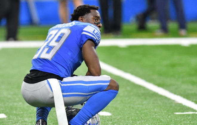 Lions cornerback Jerry Jacobs (39) pauses after time expires.