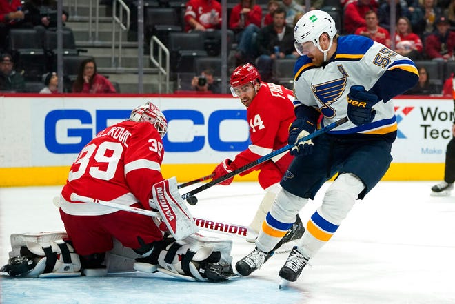 Detroit Red Wings goaltender Alex Nedeljkovic (39) stops a shot by St. Louis Blues defenseman Colton Parayko in the first period of Wednesday's game in Detroit.