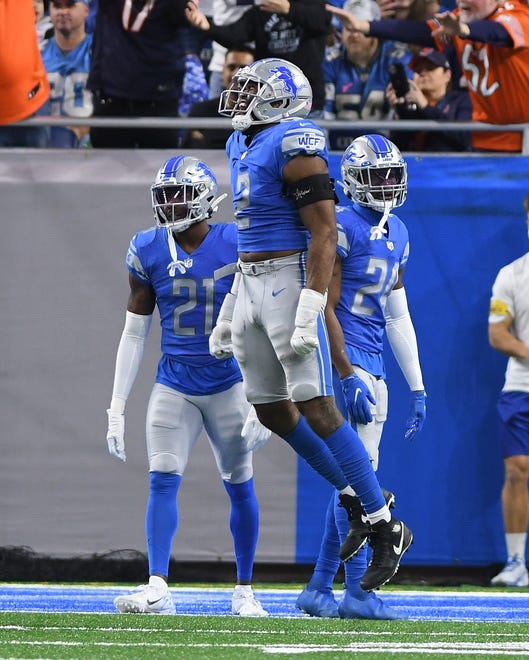 The Lions' Austin Bryant yells out after Bears tight end Jimmy Graham pulls in a touchdown reception in the end zone in the second quarter.