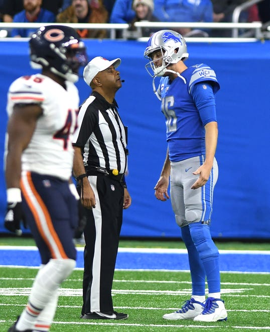 Lions quarterback Jared Goff chats with an official on the field in the fourth quarter.