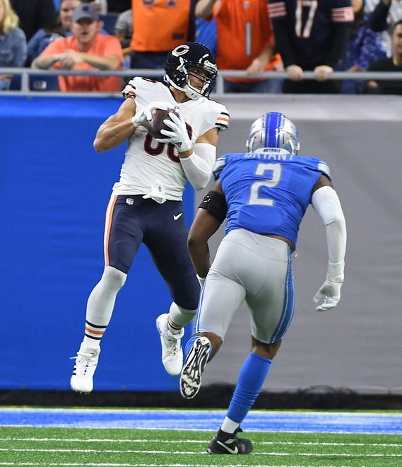 Bears tight end Jimmy Graham pulls down a touchdown reception in front of the Lions' Austin Bryant in the second quarter.