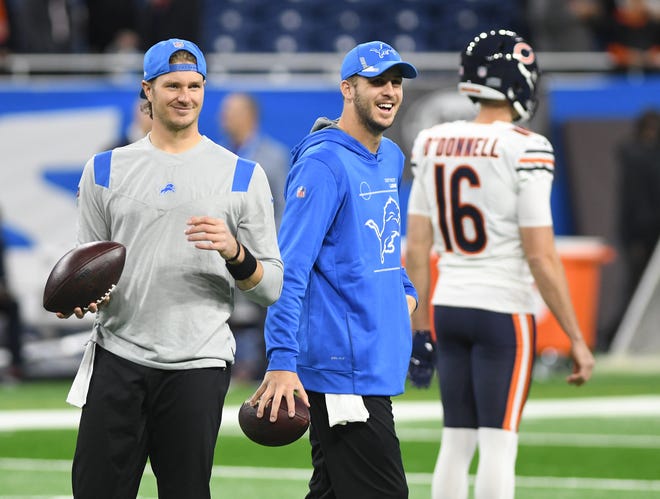 Detroit Lions quarterback Tim Boyle and Jared Goff are all smiles as they warm-up before the game between Detroit and the Chicago Bears at Ford Field in Detroit, Michigan on November 25, 2021.