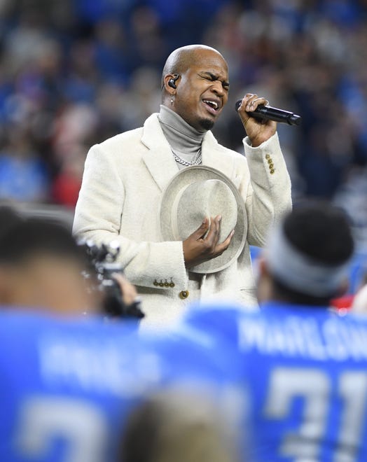 Ne-Yo sings the National Anthem before the Lions, Bears game in Detroit.