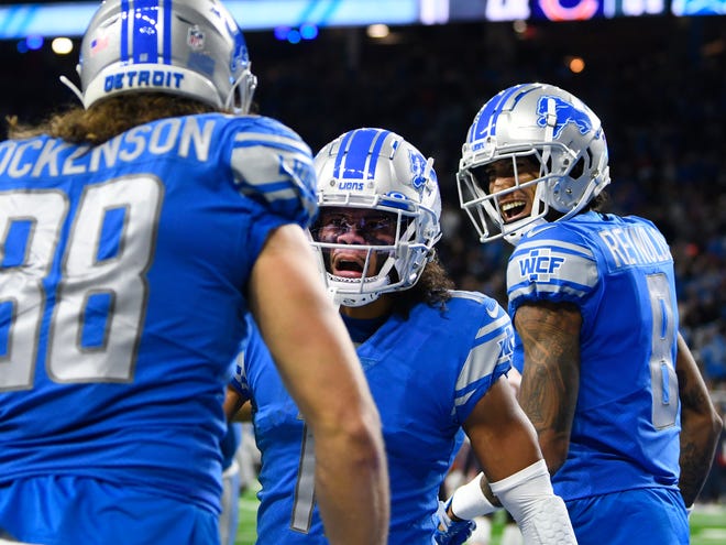Lions' Khalif Raymond and Josh Reynolds celebrate Detroit's only touchdown by tight end T.J. Hockensoon in the third quarter.