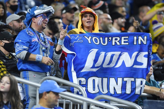 Hopeful fans in the stands during the first half of the Lions, Bears game in Detroit.