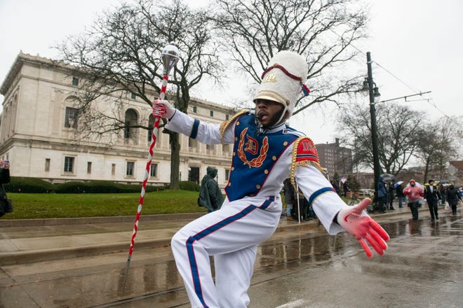 Drum Major Torona Abrams of Cass Tech High School leads the Detroit Public Schools All-City High School Marching Band in America’s Thanksgiving Parade down Woodward Avenue in the rain on Thanksgiving morning in Detroit, Thursday, Nov. 25, 2021.