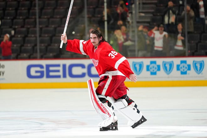 Detroit Red Wings goaltender Alex Nedeljkovic celebrates after beating the St. Louis Blues 4-2 on Wednesday in Detroit.