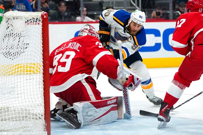 Detroit Red Wings goaltender Alex Nedeljkovic (39) stops a St. Louis Blues center Ryan O'Reilly (90) shot in the third period  on Wednesday at Little Caesars Arena in Detroit.