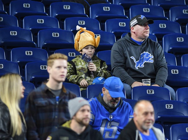 Detroit Lions fan up in the stands on Thanksgiving early Sunday morning.