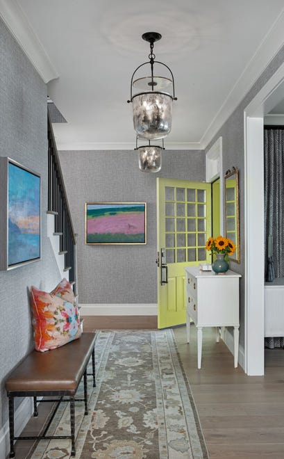 This colorful home designed by Jones-Keena & Co. features Visual Comfort lanterns by Chapman & Myers.