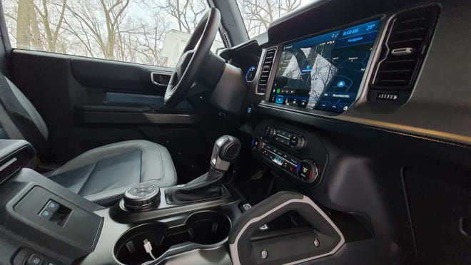 Grab handles, GOAT-mode dial for selecting drive modes and 10-speed tranny are among the tools in the 2021 Ford Bronco 2-door console.