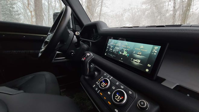 The elegant dash of the 2021 Land Rover Defender 90 features big useful dials and lots of drive modes.