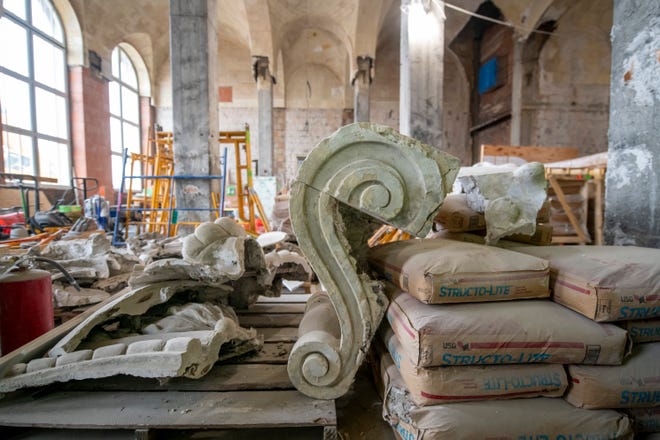 Damaged cartouches and ornaments made from cast plaster sit in piles after being removed from the walls of the main waiting area as construction continues at the Michigan Central Station, owned by Ford, in Detroit, January 11, 2022.