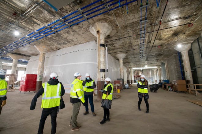 Journalists tour the former book depository now owned by Ford, in Detroit, January 11, 2022.