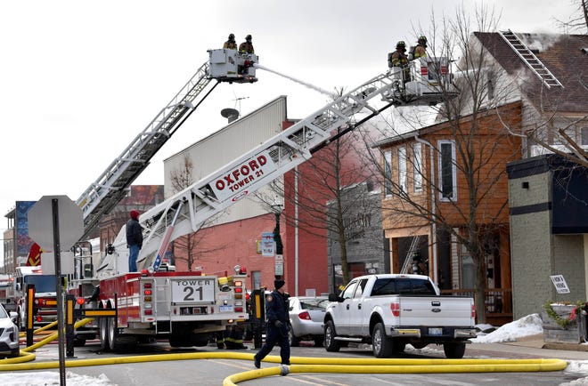 According to Orion Township Fire Chief Rob Duke, at least four fire departments and three ladder trucks battle a fire at 35 N. Broadway in historic downtown Lake Orion on Friday, Jan. 14, 2022.