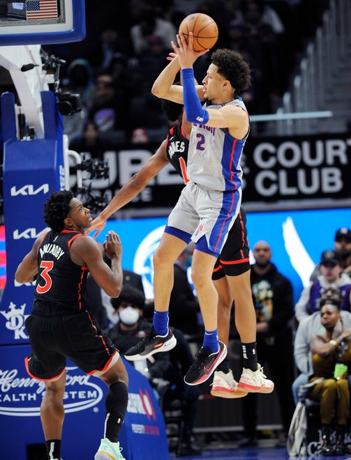 Detroit Pistons guard Cade Cunningham (2) makes a pass over Toronto Raptors forward OG Anunoby (3) in the fourth quarter.