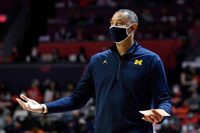 Michigan's coach Juwan Howard reacts after a play during the first half.