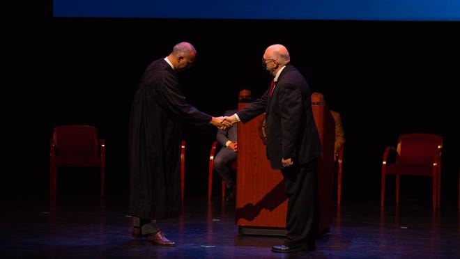 Judge Helal A Farhat swears in Councilman Kenneth Paris at the City of Dearborn Inauguration Ceremony in Dearborn, Michigan on Saturday January 15th 2022.