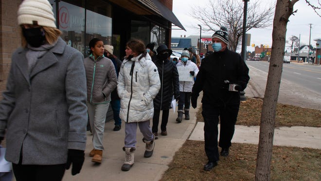 Walkers, young and old, came out on a frigid Monday to join the MLK freedom walk in Royal Oak, Michigan, on January 17, 2022.