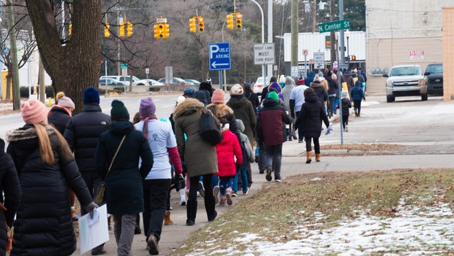 Walkers came out on a frigid Monday to attend the MLK freedom walk in Royal Oak, Michigan, on January 17, 2022.