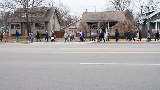 Walkers came out on a frigid Monday to join the MLK freedom walk in Royal Oak, Michigan, on January 17, 2022.