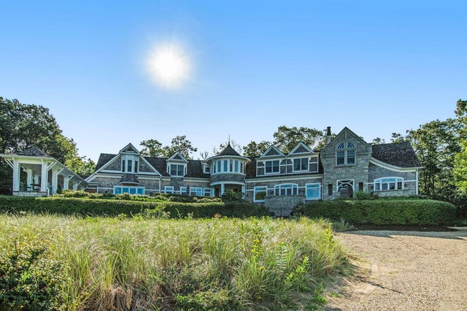 This home at 52120 Lake Park Drive in New Buffalo features nine bedrooms, seven baths and is 5,690 square feet. Asking price is $5,000,000. It is in the " Eiffel Tower " section of Grand Beach and sits atop a dune overlooking Lake Michigan.
