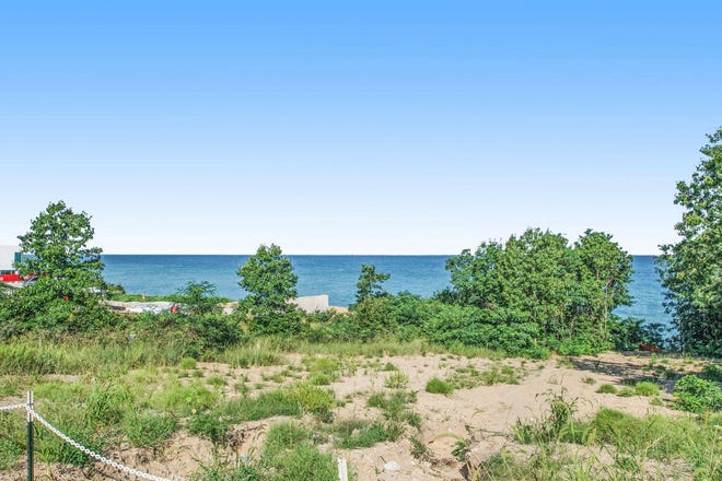 This home at 52120 Lake Park Drive in New Buffalo features nine bedrooms, seven baths and is 5,690 square feet. Asking price is $5,000,000. It is in the " Eiffel Tower " section of Grand Beach and sits atop a dune overlooking Lake Michigan.