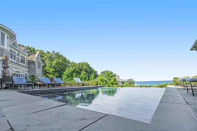 The property has an infinity pool and views of Lake Michigan.