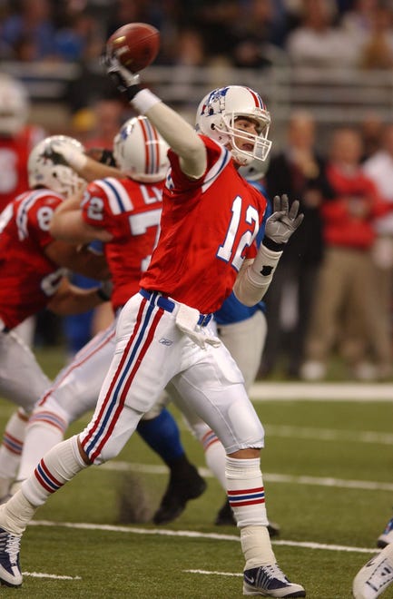 Patriots QB Tom Brady throwing during the 20-12 Lions loss on Thanksgiving day at Ford Field in Detroit, Michigan on November 28, 2002.