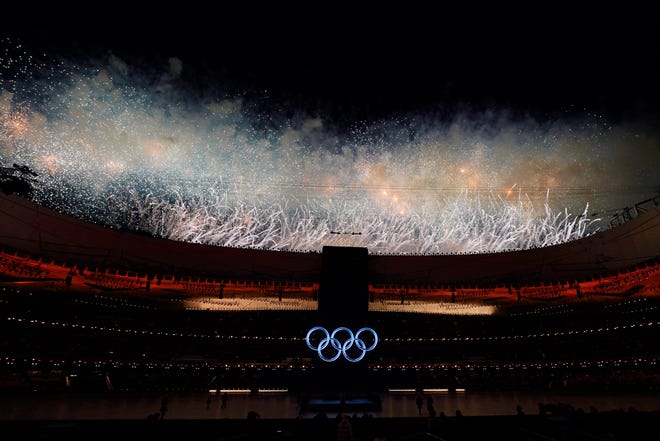 Fireworks go off during the opening ceremony of the 2022 Winter Olympics, Friday.