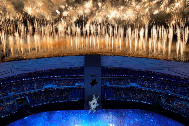 Fireworks light up the sky over Olympic Stadium during the opening ceremony of the 2022 Winter Olympics.