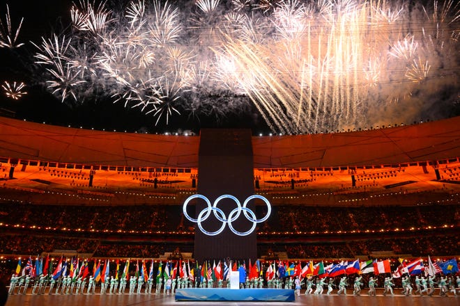 Fireworks explode over the Olympic rings during the opening ceremony of the Beijing 2022 Winter Olympic Games, at the National Stadium, known as the Bird's Nest, in Beijing.
