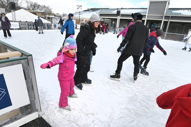 People enjoy ice skating at the M3 Skating Rink during Winter Blast in Royal Oak on Saturday, February 19, 2021.