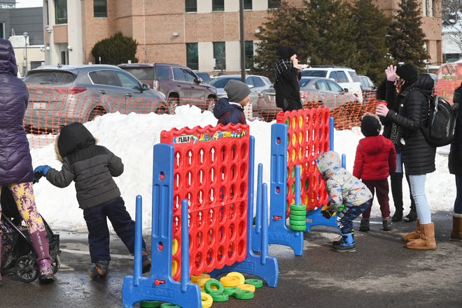 Children play at the in the winter games area during Winter Blast in Royal Oak on Saturday, February 19, 2021.