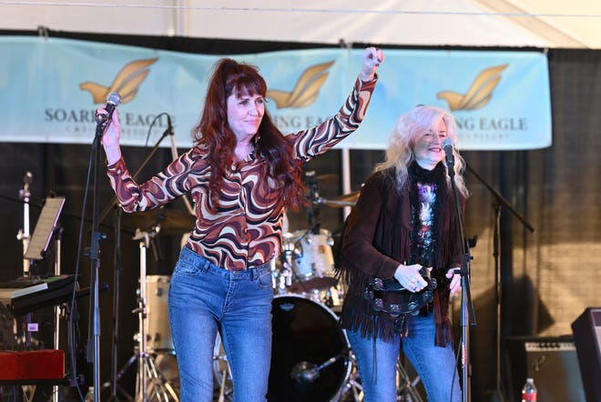 Lori Witz (left), wife of Jon Witz, Winter Blast, performs on stage with singer Maggie McCab during Winter Blast in Royal Oak on Saturday, February 19, 2021.