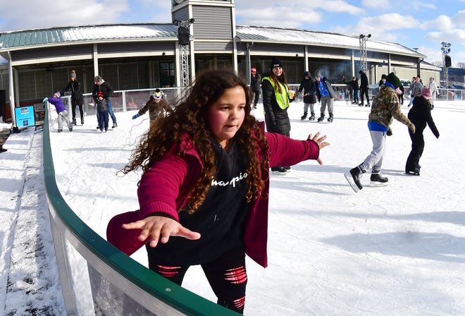 Aeriana Larkins, 10, of Taylor, makes her way around the M3 Skating Rink during Winter Blast in Royal Oak on Saturday, February 19, 2021.