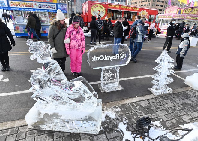 Luza Wade (left) and her daughter Chole Wade of Bloomfield Hills look at the many ice sculptures during Winter Blast in Royal Oak on Saturday, February 19, 2021.