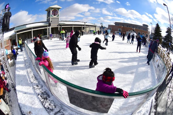 People enjoy ice skating at the M3 Skating Rink during Winter Blast in Royal Oak on Saturday, February 19, 2021.