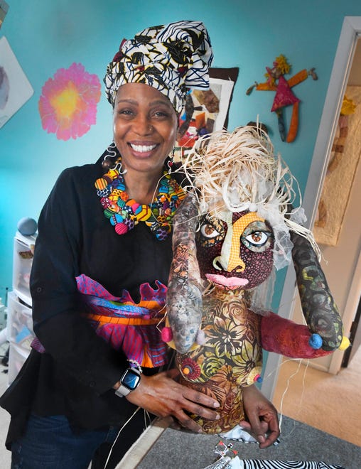 Artist April Anue Shipp with a piece entitled "Wash Day" at her home, studio in Rochester Hills