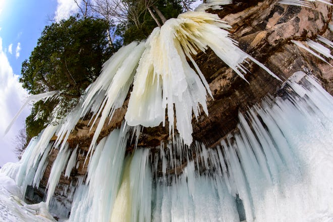 Ice hangs from the east side of Grand Island, in Lake Superior, near Munising, MI., Thursday, March 3, 2022.