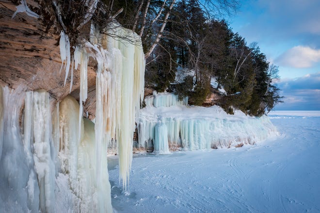 Ice drips down over a cave on Grand Island, in Lake Superior, near Munising, MI., Thursday, March 3, 2022.