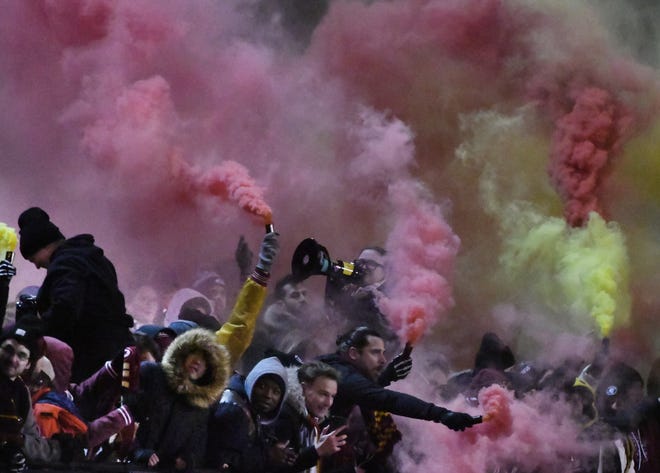 DCFC fans let the flares burn after going up 2-1 on a penalty kick late in the second half against the Columbus Crew in a match last month.