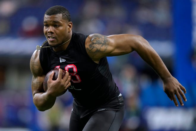 Georgia defensive lineman Travon Walker, who did not attend the draft in Las Vegas, running during the NFL football scouting combine in March, is picked 1st at the 2022 NFL Draft.