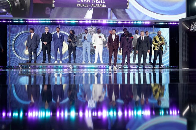 Top prospects gather on the stage during the first round of the NFL football draft Thursday, April 28, 2022, in Las Vegas.