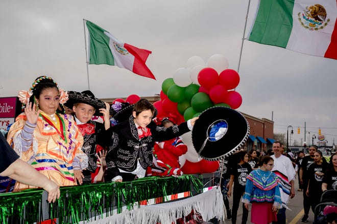 Lucas Daly, 9, of Detroit tips his hat during the 57th annual Cinco de Mayo Parade in Detroit on May 1, 2022.