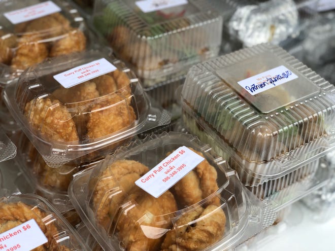 Another great snack at the Thai market, golden and crispy puffs stuffed with curried chicken.