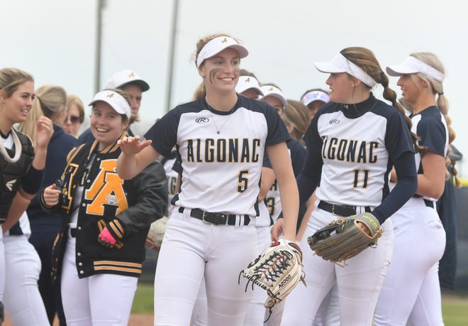 Algonac's junior Ella Stephenson, center, celebrates with teammates after the the 1-0 victory over Macomb Dakota in Macomb, Michigan on May 5, 2022.