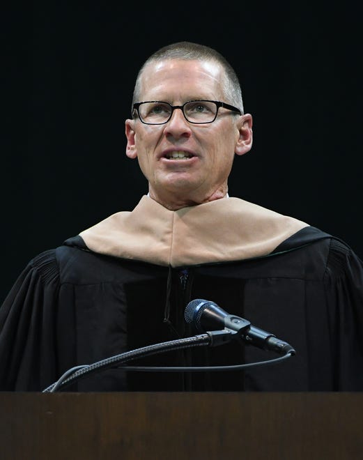 Wendys President and Chief Executive Officer Todd Penegor receives an honorary degree during the Michigan State University commencement ceremony at the Breslin Center in E. Lansing, Michigan on May 6, 2022.