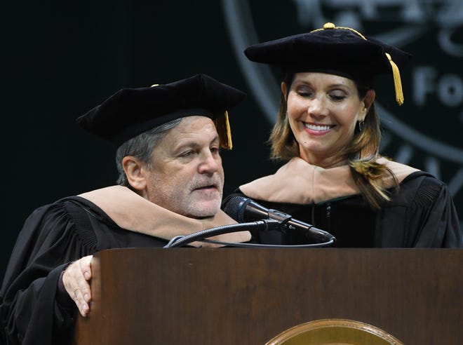 Founder and Chairman of Rocket Companies and Quicken Loans Dan Gilbert and business leader and philanthropist Jennifer Gilbert receive honorary degrees during the Michigan State University commencement ceremony at the Breslin Center in E. Lansing, Michigan on May 6, 2022.